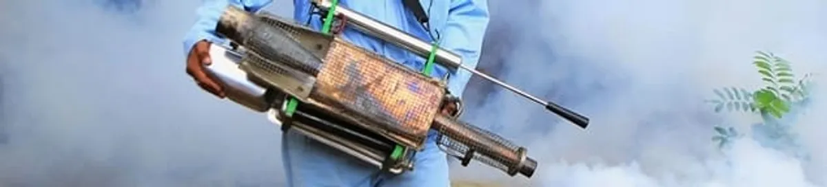 Fumigation technician using a fogger for deep pest treatment in Scottsdale, AZ